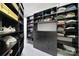 Organized walk-in closet with custom shelving, drawers, and ample storage space at 8016 Pemswood St, Charlotte, NC 28277