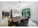 Elegant dining room with stylish table, large window overlooking the yard, and contemporary decor at 8016 Pemswood St, Charlotte, NC 28277