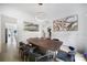 Bright dining room featuring a large table, contemporary lighting, and neutral decor for elegant dining experiences at 8016 Pemswood St, Charlotte, NC 28277