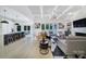 Bright open living room with view of breakfast bar and access to backyard at 8016 Pemswood St, Charlotte, NC 28277