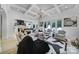 Open living room with coffered ceiling, view to kitchen and backyard at 8016 Pemswood St, Charlotte, NC 28277