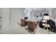 Open living space with lots of seating, a desk near shuttered windows, and a vaulted ceiling at 8016 Pemswood St, Charlotte, NC 28277