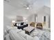 Spacious living room with plush sofas, cozy chairs, ceiling fan, and neutral decor at 8016 Pemswood St, Charlotte, NC 28277
