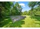 This home's backyard includes a basketball court at 8900 Cumbria Ct, Huntersville, NC 28078