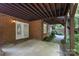 Backyard featuring brick exterior, concrete patio, and landscaping at 8900 Cumbria Ct, Huntersville, NC 28078