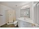 Bathroom featuring shower stall and white vanity with granite countertop at 8900 Cumbria Ct, Huntersville, NC 28078