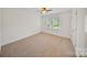 Bedroom with neutral carpet, a ceiling fan, and natural light at 8900 Cumbria Ct, Huntersville, NC 28078