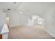 This spacious bonus room has lots of natural light and neutral carpeting at 8900 Cumbria Ct, Huntersville, NC 28078
