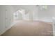 Spacious bonus room offers lots of natural light and neutral carpeting at 8900 Cumbria Ct, Huntersville, NC 28078