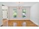 Formal dining room with hardwood floors, chair rail and natural light from two windows at 8900 Cumbria Ct, Huntersville, NC 28078