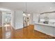 Spacious kitchen with white cabinetry, stainless steel appliances, and a large island with a breakfast bar at 8900 Cumbria Ct, Huntersville, NC 28078