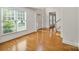 Sunlit living room showcasing hardwood floors and neutral walls at 8900 Cumbria Ct, Huntersville, NC 28078