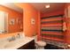 Inviting full bathroom featuring a granite countertop, toilet, and colorful shower curtain at 903 Von Buren Blvd, Rock Hill, SC 29730