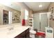 Neutral bathroom features a single vanity, a shower with glass doors, and red accents at 903 Von Buren Blvd, Rock Hill, SC 29730