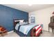 Comfortable bedroom featuring a blue accent wall and natural light at 903 Von Buren Blvd, Rock Hill, SC 29730