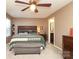 Comfortable bedroom features a ceiling fan, carpet flooring, and ensuite bathroom at 903 Von Buren Blvd, Rock Hill, SC 29730