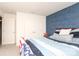 Bedroom boasts a stylish blue accent wall and ample natural light from the window at 903 Von Buren Blvd, Rock Hill, SC 29730
