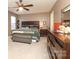 Comfortable bedroom with neutral tones, carpet flooring, ceiling fan, and large dresser at 903 Von Buren Blvd, Rock Hill, SC 29730
