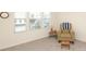Cozy bedroom features carpet, natural light, and comfortable chair at 903 Von Buren Blvd, Rock Hill, SC 29730