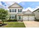 Charming two-story home with a well-manicured lawn and two car garage at 903 Von Buren Blvd, Rock Hill, SC 29730