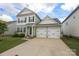 Charming home featuring an attached two car garage and a well-kept lawn at 903 Von Buren Blvd, Rock Hill, SC 29730