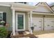 A welcoming entryway with a decorative storm door and flowering plants at 903 Von Buren Blvd, Rock Hill, SC 29730