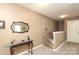 Upstairs hallway features a decorative table and mirror, a small railing and access to a bedroom at 903 Von Buren Blvd, Rock Hill, SC 29730