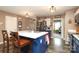 Bright kitchen with an island, wooden barstools and stainless steel appliances at 903 Von Buren Blvd, Rock Hill, SC 29730
