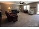 Inviting living room with neutral tones, comfortable seating, piano and ample natural light at 903 Von Buren Blvd, Rock Hill, SC 29730