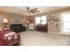 Expansive living room with carpet, neutral colors, ceiling fan, and ample natural light at 903 Von Buren Blvd, Rock Hill, SC 29730
