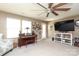 Sunlit living room boasting plush carpeting, a large TV, and open floor plan at 903 Von Buren Blvd, Rock Hill, SC 29730