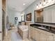 Luxurious bathroom features a soaking tub, dual vanities, and travertine tile at 9730 White Frost Rd, Charlotte, NC 28277