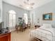 Bright bedroom with large windows, desk, and bed, creating a relaxing and airy space at 9730 White Frost Rd, Charlotte, NC 28277