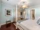 Spacious bedroom featuring a four-poster bed, wood floors, and ample closet space at 9730 White Frost Rd, Charlotte, NC 28277