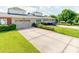 Attached home with a two-car garage and a neatly kept lawn at 9730 White Frost Rd, Charlotte, NC 28277