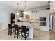Bright kitchen features an island with seating, stainless steel appliances, and classic white cabinetry at 9730 White Frost Rd, Charlotte, NC 28277