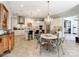 Spacious kitchen with a dining area featuring an elegant chandelier and stainless steel appliances at 9730 White Frost Rd, Charlotte, NC 28277