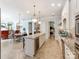 Open kitchen featuring an island with beverage cooler, stainless appliances, and seamless access to dining and living spaces at 9730 White Frost Rd, Charlotte, NC 28277