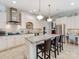 Well-equipped kitchen with stainless steel appliances, an island with seating, and granite countertops at 9730 White Frost Rd, Charlotte, NC 28277
