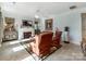 Cozy living room features a fireplace, comfortable seating, and decorative accents at 9730 White Frost Rd, Charlotte, NC 28277