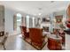 Sun-drenched living room with large windows, fireplace, and seating at 9730 White Frost Rd, Charlotte, NC 28277