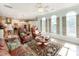 Bright living room boasts a decorative rug, stylish furnishings and large windows at 9730 White Frost Rd, Charlotte, NC 28277