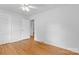 Spacious bedroom features hardwood floors, white walls, and a closet with sliding doors at 1024 Regency Dr, Charlotte, NC 28211