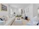 Inviting living room with hardwood floors, paneled walls, and staircase access at 1024 Regency Dr, Charlotte, NC 28211