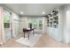 Bright living room with a built-in bookcase and a desk, great natural light, and hardwood floors at 1024 Regency Dr, Charlotte, NC 28211