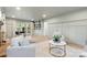Spacious living room with stylish decor and a built-in bookshelf for added storage and charm at 1024 Regency Dr, Charlotte, NC 28211