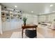 Stylish living room boasts built-in shelving, soft green walls, and a bright, airy atmosphere at 1024 Regency Dr, Charlotte, NC 28211