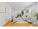 Elegant living room featuring hardwood floors, paneled walls, and natural light at 1024 Regency Dr, Charlotte, NC 28211