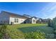 Wide view of the backyard featuring a lush green lawn and a fence line in the distance at 11031 Larkslea Ln, Charlotte, NC 28278