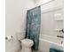 Functional bathroom with shower-tub combination and a seashell themed shower curtain at 11031 Larkslea Ln, Charlotte, NC 28278